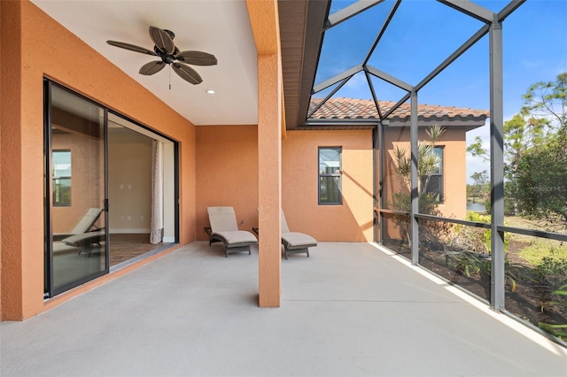 sunroom / solarium with ceiling fan