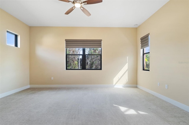 carpeted empty room with ceiling fan