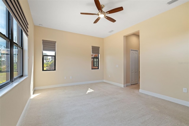 carpeted empty room with ceiling fan