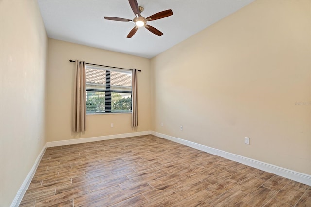 spare room featuring ceiling fan and light wood-type flooring