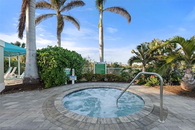 view of pool featuring a hot tub