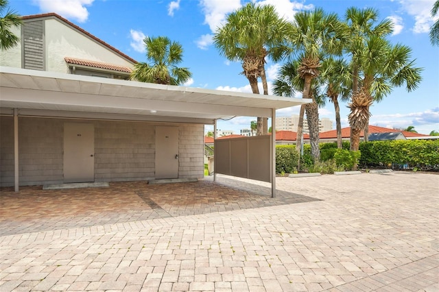 view of vehicle parking featuring a carport