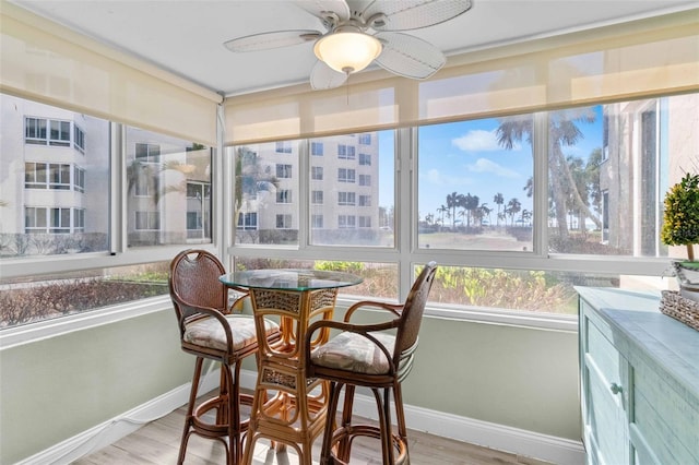 sunroom with ceiling fan