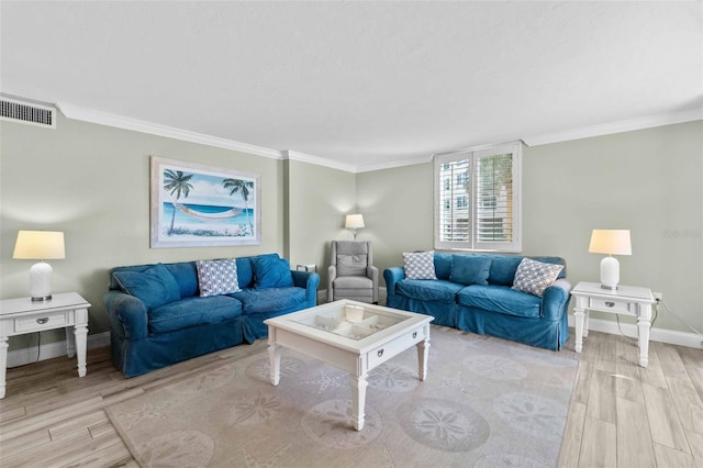 living room featuring ornamental molding and light hardwood / wood-style flooring