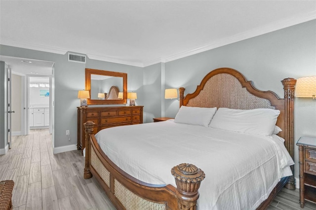 bedroom featuring ornamental molding and light wood-type flooring