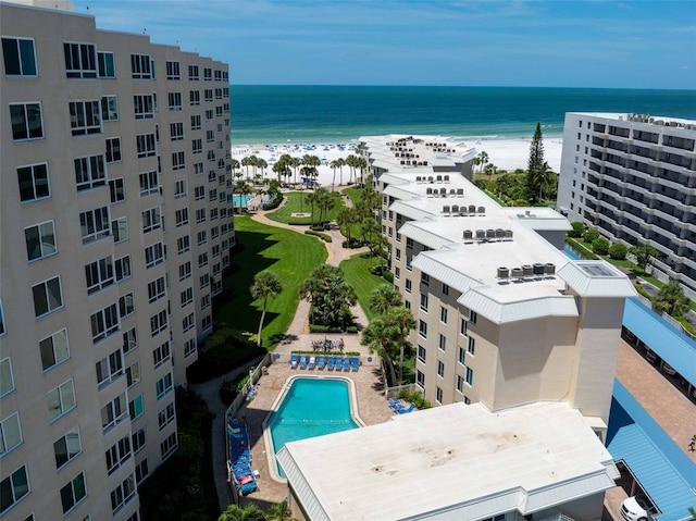 drone / aerial view with a beach view and a water view