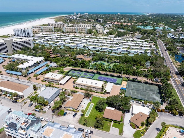 bird's eye view featuring a water view and a view of the beach