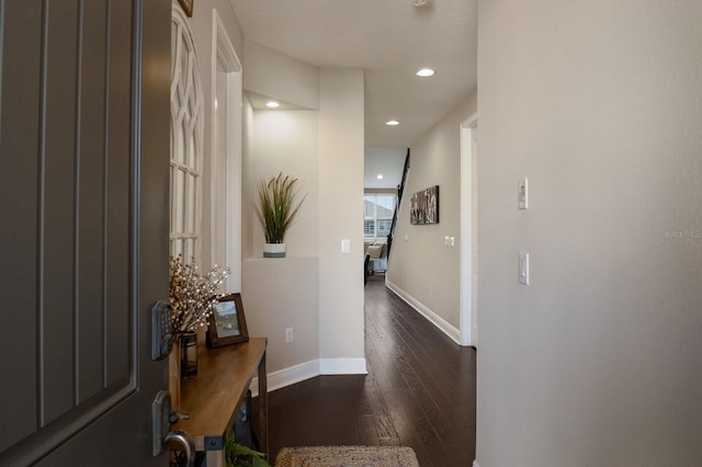 corridor featuring dark hardwood / wood-style floors