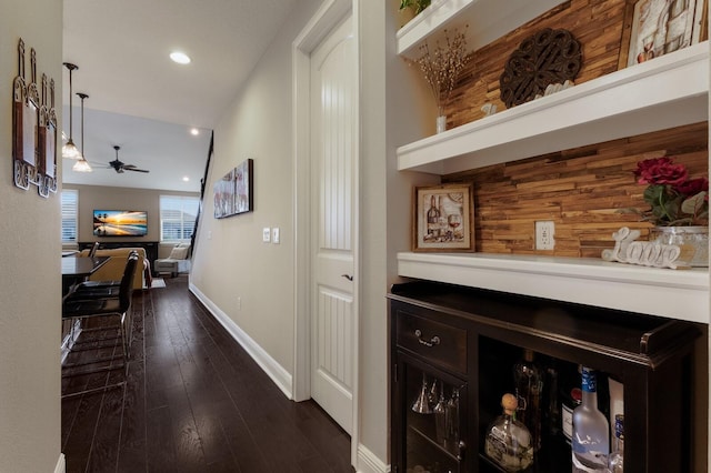 hall with dark wood-type flooring