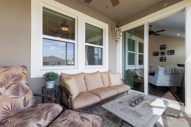 exterior space featuring ceiling fan and an outdoor living space