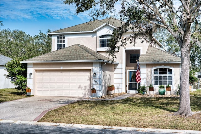 front facade with a garage and a front lawn