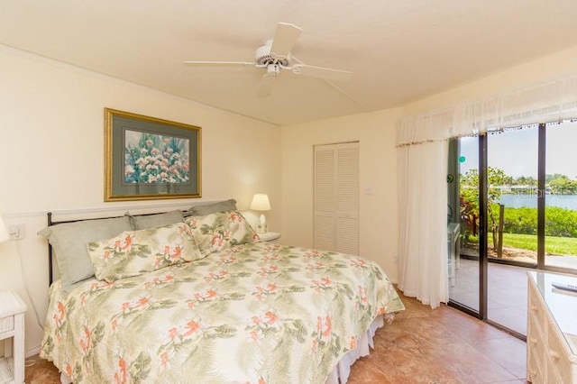 bedroom featuring access to outside, a closet, and ceiling fan