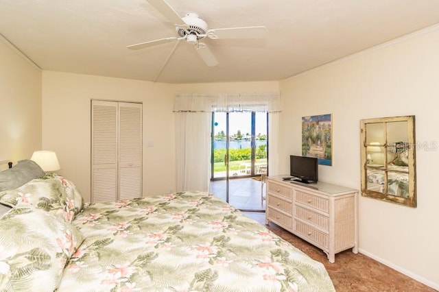 bedroom featuring access to outside, a closet, and ceiling fan