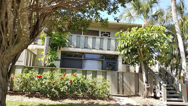 back of property featuring a balcony