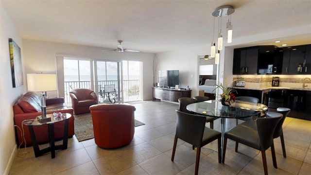 dining room with sink and ceiling fan