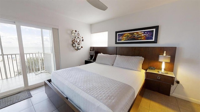 bedroom with access to exterior, light tile patterned floors, and ceiling fan