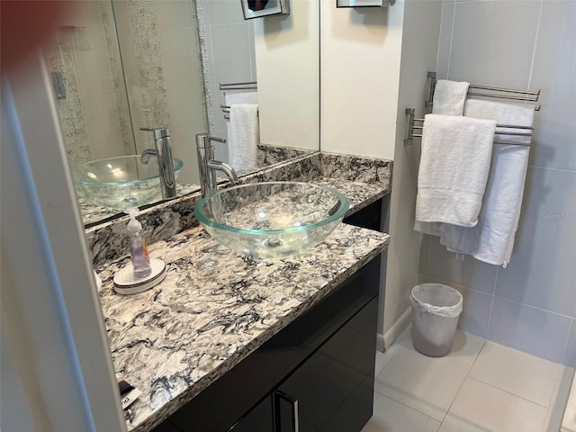 bathroom featuring vanity and tile patterned flooring