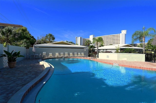 view of swimming pool with a patio area