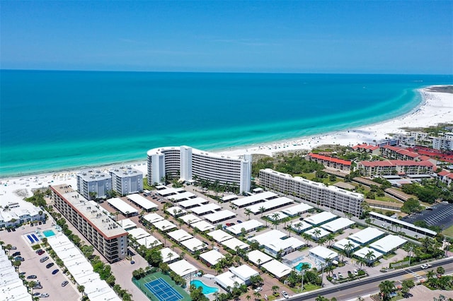 birds eye view of property featuring a water view and a view of the beach