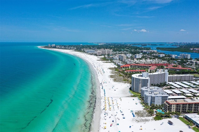 aerial view featuring a view of the beach and a water view