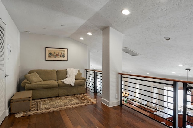 interior space with wood-type flooring and a textured ceiling