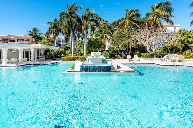 view of pool featuring a pergola, a jacuzzi, and a patio area