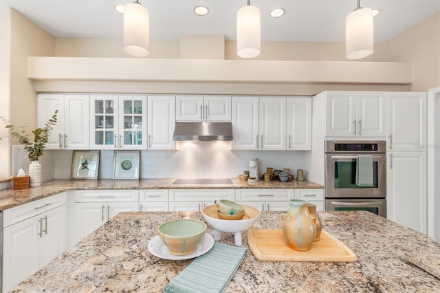 kitchen featuring pendant lighting, double oven, white cabinetry, and black electric cooktop