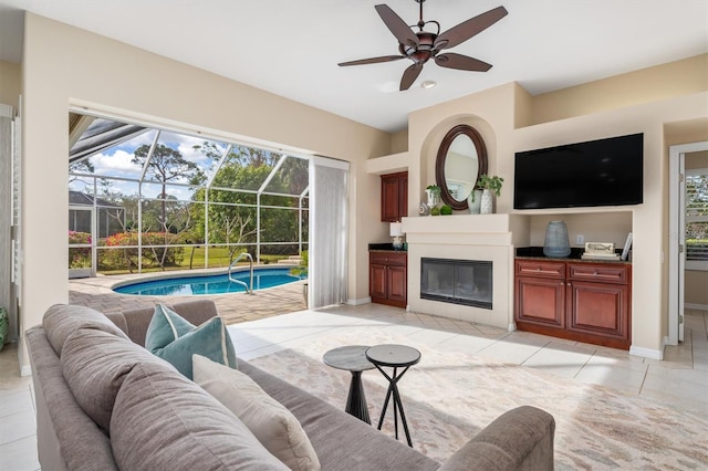 tiled living room featuring ceiling fan