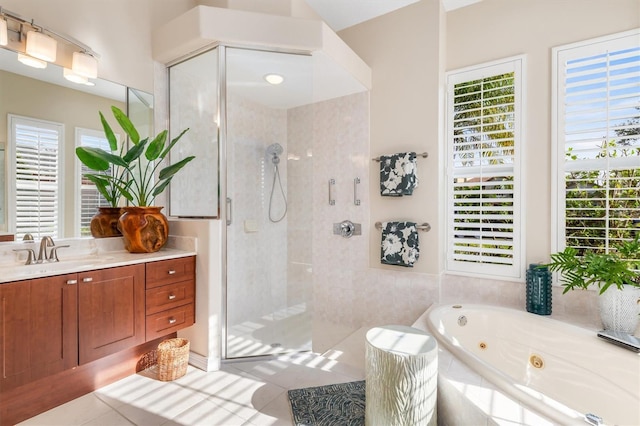 bathroom featuring tile patterned floors, separate shower and tub, and vanity