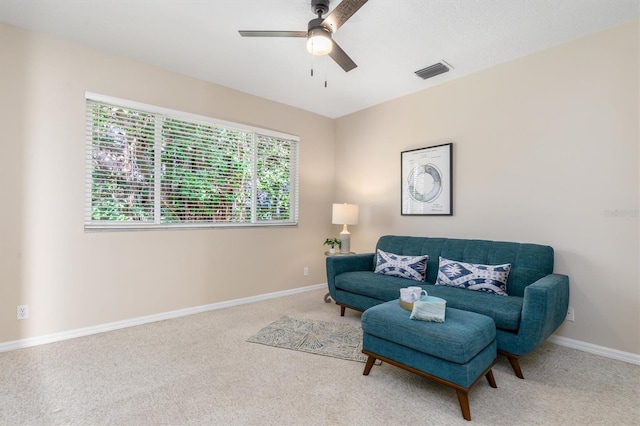 sitting room with carpet flooring and ceiling fan