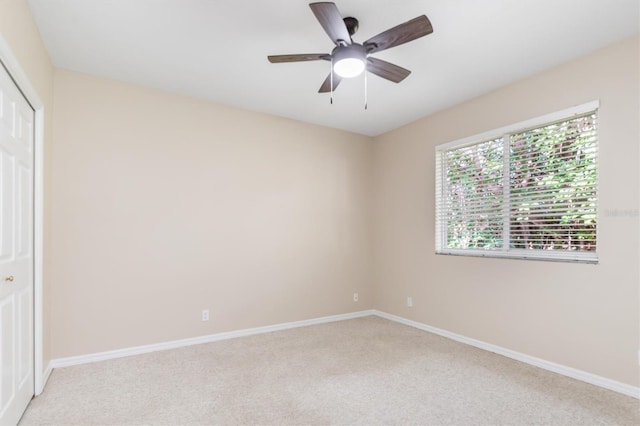 carpeted empty room with ceiling fan