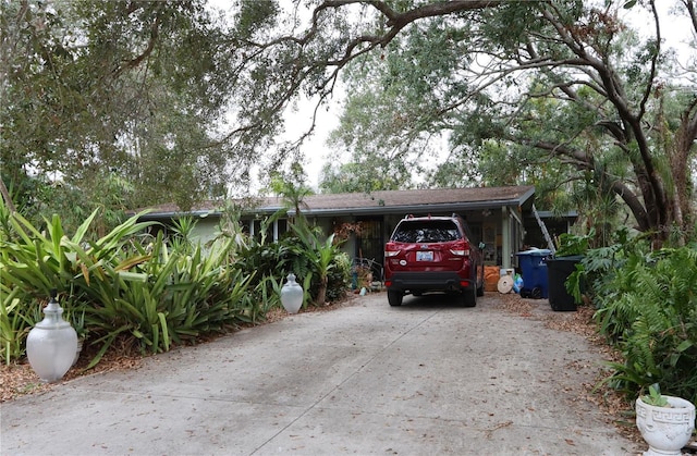 view of front of home with a carport