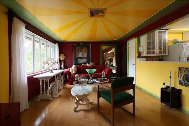 sitting room featuring wood-type flooring