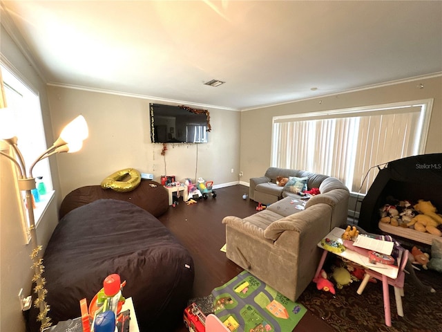 living room featuring dark hardwood / wood-style flooring and crown molding