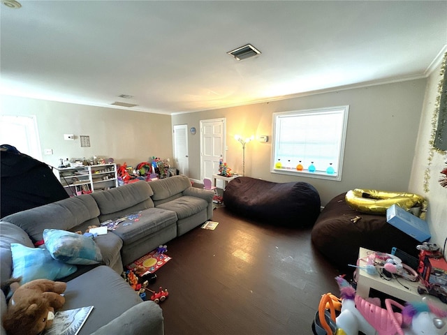 living room with crown molding and dark hardwood / wood-style flooring