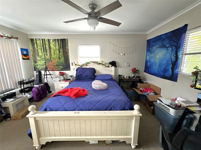 carpeted bedroom featuring crown molding and ceiling fan