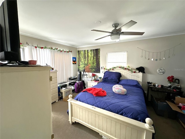 bedroom featuring crown molding, ceiling fan, and carpet floors