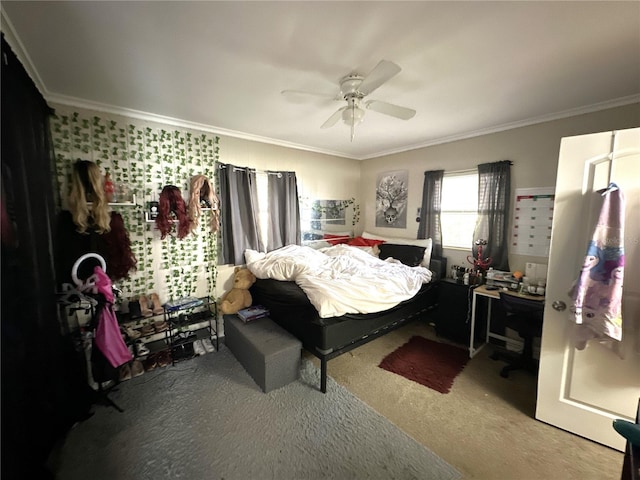 bedroom featuring crown molding, ceiling fan, and carpet