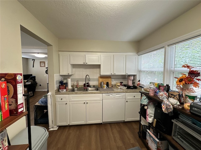 kitchen with sink, dishwasher, backsplash, dark hardwood / wood-style floors, and white cabinets