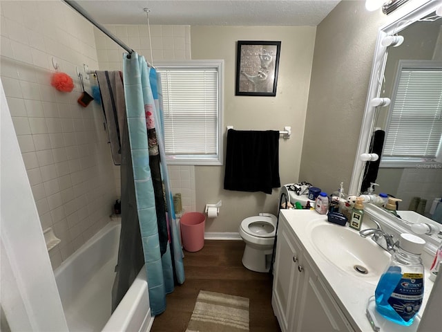 full bathroom featuring wood-type flooring, toilet, shower / tub combo, and vanity