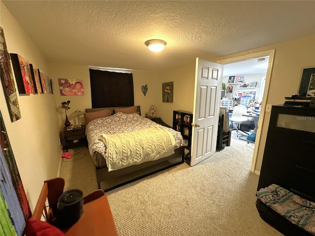 carpeted bedroom with a textured ceiling