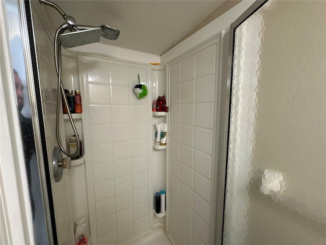 bathroom with tiled shower