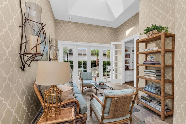 sitting room featuring french doors and a skylight