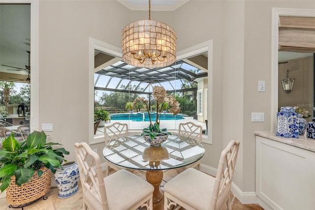 dining area with an inviting chandelier and ornamental molding