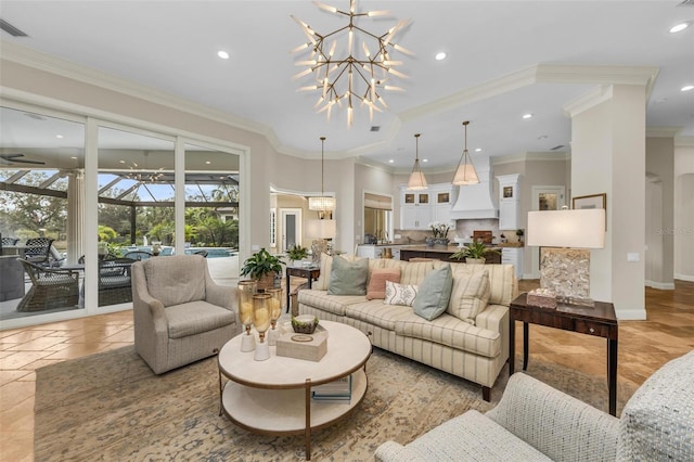 living room with crown molding and a notable chandelier