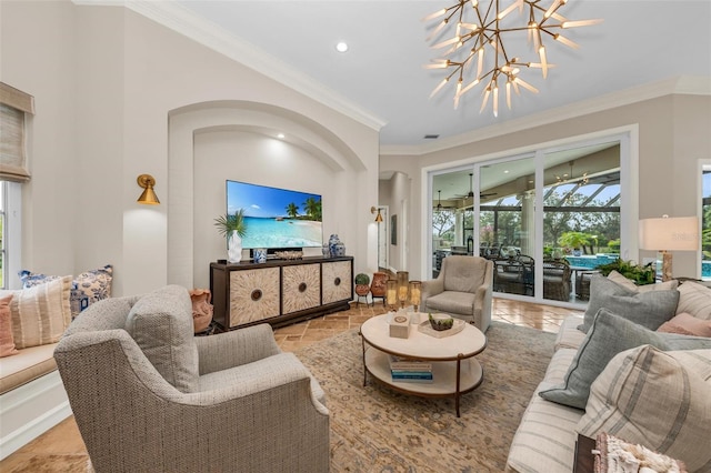 living room featuring ornamental molding and a notable chandelier