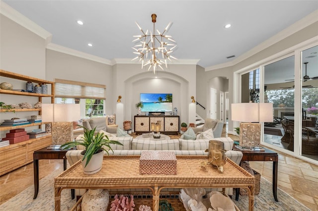 living room with crown molding and ceiling fan with notable chandelier