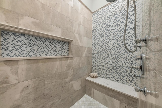 bathroom featuring a tile shower