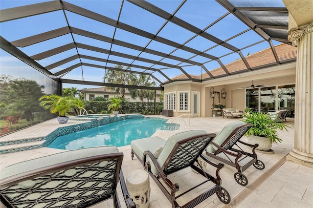 view of pool with ceiling fan, glass enclosure, a patio area, french doors, and an in ground hot tub