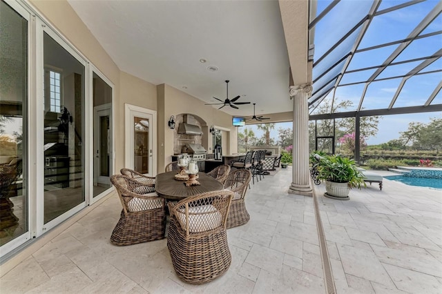 view of patio / terrace with a lanai and ceiling fan